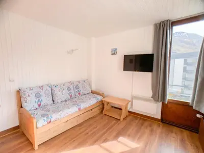 Coin salon dans l'établissement Studio confortable à Tignes avec balcon et animaux admis - FR-1-502-498