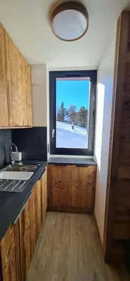 Cuisine ou kitchenette dans l'établissement les etoiles de la plagne le quartz