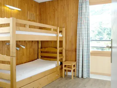 Un ou plusieurs lits dans un hébergement de l'établissement Appartement rénové au pied des pistes avec balcon à Tignes - FR-1-502-512
