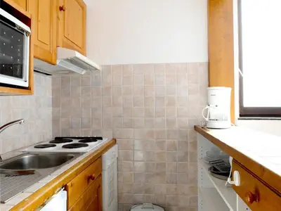 Cuisine ou kitchenette dans l'établissement Résidence Tommeuses - Appartement fonctionnel·Pieds des pistes ·Balcon MAE-3654