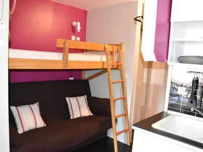 Un ou plusieurs lits dans un hébergement de l'établissement Studio plein sud 4 pers, proche centre, terrasse - FR-1-464-216