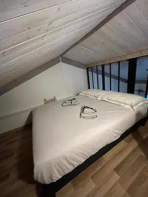 Un ou plusieurs lits dans un hébergement de l'établissement Le Petit Chalet Addicted to Paradise