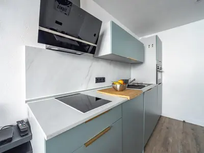 Cuisine ou kitchenette dans l'établissement Studio confortable skis aux pieds avec balcon et WIFI - FR-1-502-524
