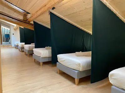 Un ou plusieurs lits dans un hébergement de l'établissement Gîte 14 pers LesOursFanfarons spacieux chaleureux