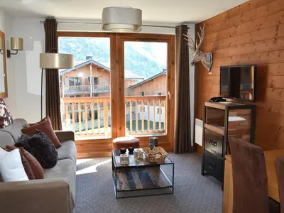 Télévision ou salle de divertissement dans l'établissement Bel appartement avec balcon et parking couvert - FR-1-464-217