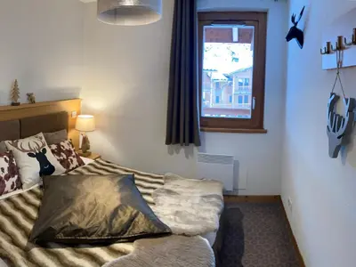 Un ou plusieurs lits dans un hébergement de l'établissement Bel appartement avec balcon et parking couvert - FR-1-464-217