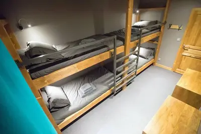 Un ou plusieurs lits dans un hébergement de l'établissement HaKaJu Appartement 10 personnes à Val Cenis