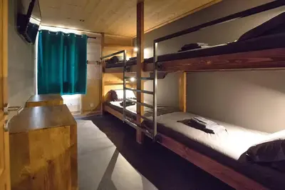 Un ou plusieurs lits dans un hébergement de l'établissement HaKaJu Appartement 10 personnes à Val Cenis