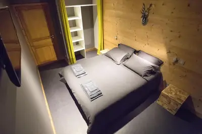 Un ou plusieurs lits dans un hébergement de l'établissement HaKaJu Appartement 10 personnes à Val Cenis