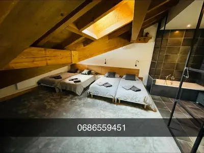 Un ou plusieurs lits dans un hébergement de l'établissement Beaver Creek appartement 12 Personnes à Val Cenis