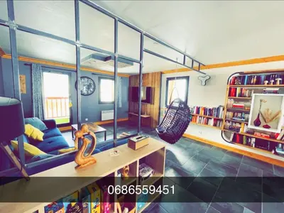 Coin salon dans l'établissement Beaver Creek appartement 12 Personnes à Val Cenis