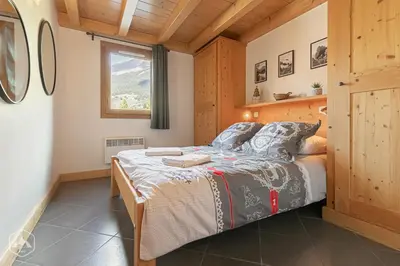 Un ou plusieurs lits dans un hébergement de l'établissement Le Marteen’s appartement pour 6 personnes à Val Cenis