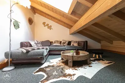 Coin salon dans l'établissement Le Marteen’s appartement pour 6 personnes à Val Cenis