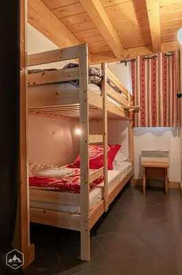 Un ou plusieurs lits dans un hébergement de l'établissement Le Marteen’s appartement pour 6 personnes à Val Cenis