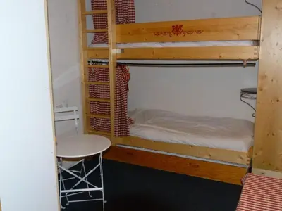 Un ou plusieurs lits dans un hébergement de l'établissement Appartement cosy 2 pièces pour 5 pers. à Arc 1800, proche pistes - FR-1-411-895