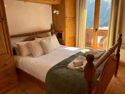 Un ou plusieurs lits dans un hébergement de l'établissement Montagnard - 4 bedroom apartment with stunning views