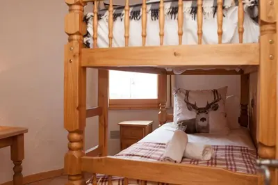 Un ou plusieurs lits dans un hébergement de l'établissement Montagnard - 4 bedroom apartment with stunning views