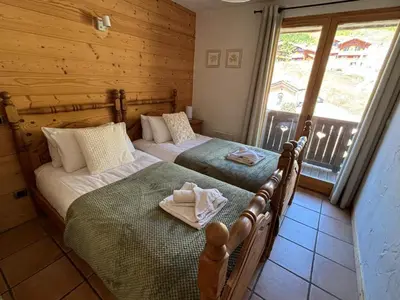 Un ou plusieurs lits dans un hébergement de l'établissement Montagnard - 4 bedroom apartment with stunning views