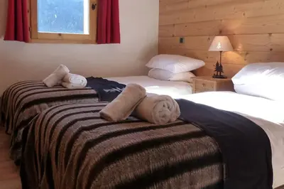 Un ou plusieurs lits dans un hébergement de l'établissement Montseti - 3 bedroom ski-in ski-out apartment