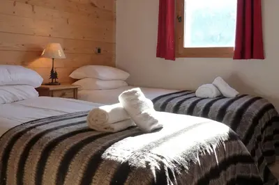Un ou plusieurs lits dans un hébergement de l'établissement Montseti - 3 bedroom ski-in ski-out apartment