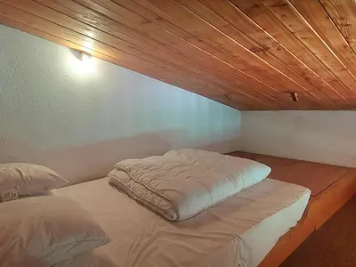 Un ou plusieurs lits dans un hébergement de l'établissement Appartement spacieux 9 pers. · Ski aux pieds · Wifi inclus - FR-1-346-553