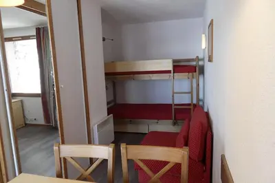Un ou plusieurs lits dans un hébergement de l'établissement Studio 28m2 vue pistes plein sud du dimanche au dimanche