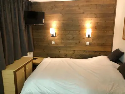Un ou plusieurs lits dans un hébergement de l'établissement Studio 28m2 vue pistes plein sud du dimanche au dimanche