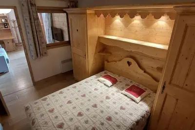 Un ou plusieurs lits dans un hébergement de l'établissement Paradiski bel appartement rénové plan peisey