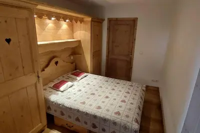 Un ou plusieurs lits dans un hébergement de l'établissement Paradiski bel appartement rénové plan peisey