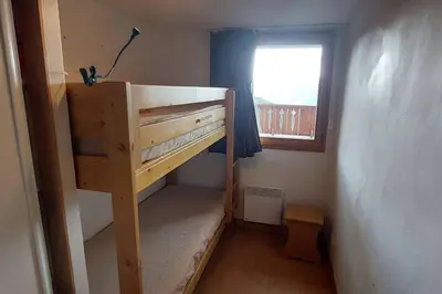 Un ou plusieurs lits dans un hébergement de l'établissement Paradiski bel appartement rénové plan peisey