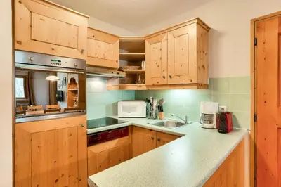 Cuisine ou kitchenette dans l'établissement Résidence Les Arcs 1950 Le Village - maeva Home - Appartement 3 Pièces 6 Personnes - Sélection MAE-4534