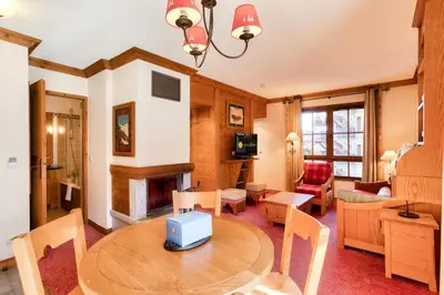 Coin salon dans l'établissement Résidence Les Arcs 1950 Le Village - maeva Home - Appartement 2 pièces 4 personnes - Prestige MAE-0204
