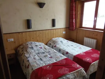 Un ou plusieurs lits dans un hébergement de l'établissement Chalet l'aubépine résidence B&B
