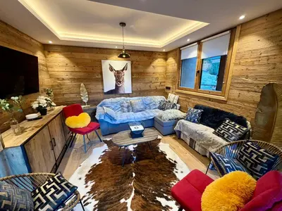 Coin salon dans l'établissement Le Refuge d'Ours, Champagny