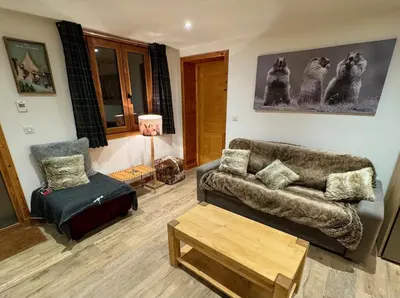 Coin salon dans l'établissement Le Refuge d'Ours, Champagny
