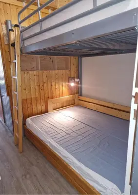 Un ou plusieurs lits dans un hébergement de l'établissement Grand Arbois Appartement 5 personnes Les Arcs 1800