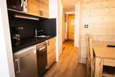Cuisine ou kitchenette dans l'établissement Résidence Les Constellations - maeva Home - Studio 4 Personnes - Confort MAE-4098