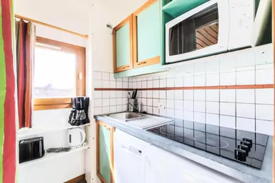 Cuisine ou kitchenette dans l'établissement Résidence Les Chalets des Arolles - maeva Home - Studio 5 Personnes - Sélection MAE-0004
