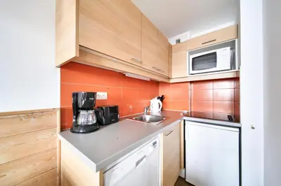 Cuisine ou kitchenette dans l'établissement Résidence Les Gémeaux - maeva Home - Studio 4 Personnes - Confort MAE-7474