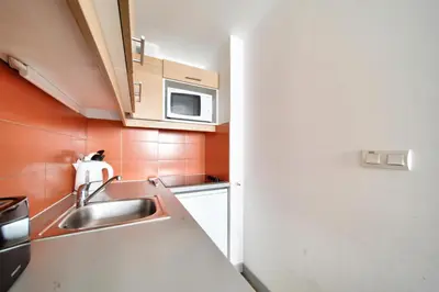 Cuisine ou kitchenette dans l'établissement Résidence Les Gémeaux - maeva Home - Studio 4 Personnes - Confort MAE-7474