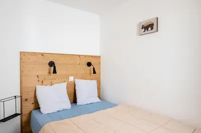 Un ou plusieurs lits dans un hébergement de l'établissement Résidence Les Constellations - maeva Home - 2 Pièces 5 personnes Sélection MAE-7324