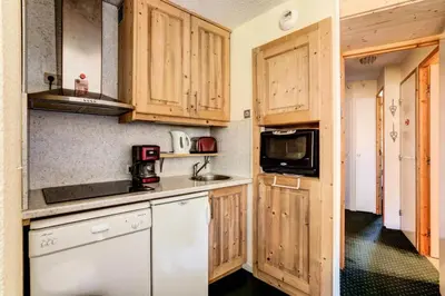 Cuisine ou kitchenette dans l'établissement Résidence Callisto - maeva Home - Appartement 3 pièces 6 personnes - Budget MAE-8964
