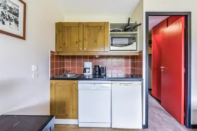 Cuisine ou kitchenette dans l'établissement Résidence Le Quartz - maeva Home - 2 Pièces 4 Personnes Sélection MAE-3890