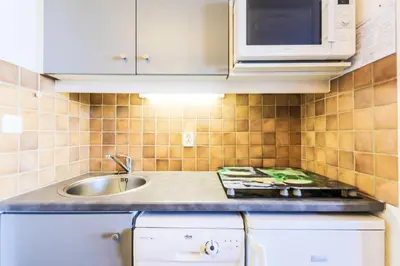 Cuisine ou kitchenette dans l'établissement Résidence Les Constellations - maeva Home - Appartement 2 Pièces 5 Personnes - Selection MAE-0341