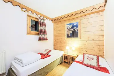 Un ou plusieurs lits dans un hébergement de l'établissement Résidence L'Ecrin des Neiges - maeva Home - Appartement 4 Pièces 8 Personnes - Sélection MAE-2873