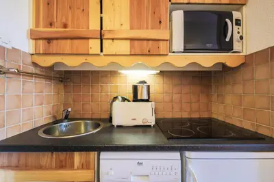 Cuisine ou kitchenette dans l'établissement Résidence Les Constellations - maeva Home - Appartement 2 Pièces 5 Personnes - Confort MAE-3350