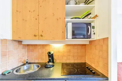 Cuisine ou kitchenette dans l'établissement Résidence Les Constellations - maeva Home - 2 Pièces 5 Personnes Sélection MAE-8856