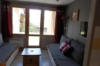 Coin salon dans l'établissement Résidence Themis - Appartement chaleureux · Ski aux pieds · Vue pistes MAE-8284