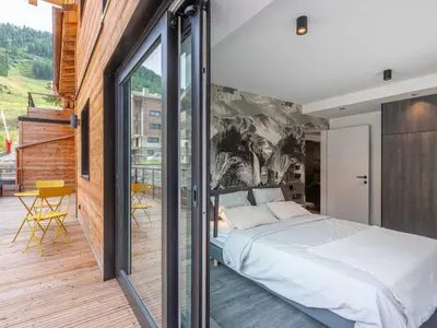 Un ou plusieurs lits dans un hébergement de l'établissement Bel appartement avec wifi, garage, cheminée et grande terrasse au pied des pistes à Val-d'Isère - FR-1-694-325