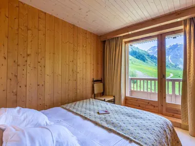 Un ou plusieurs lits dans un hébergement de l'établissement Duplex de standing au pied des pistes avec cheminée, terrasse et garage – Modane - FR-1-694-329